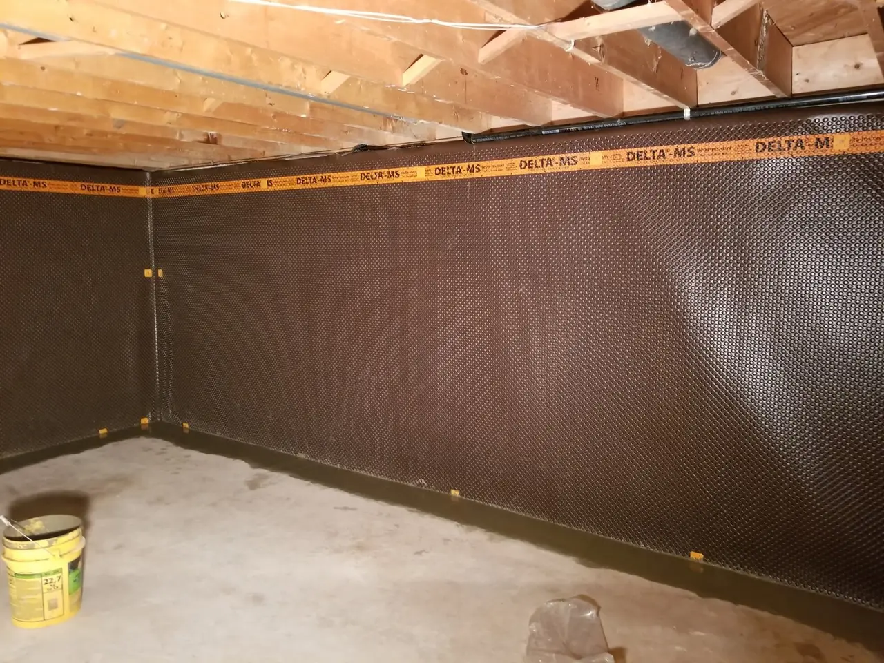 Interior drainage membrane installed along basement walls