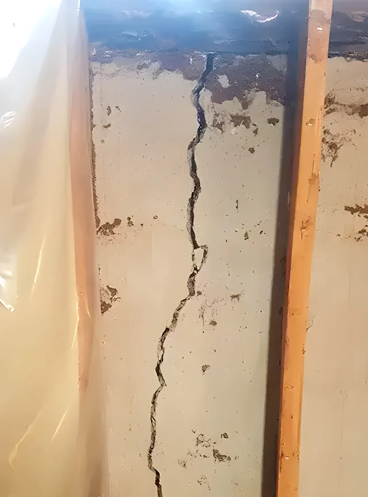 Structural crack in a poured concrete foundation wall sealed and repaired